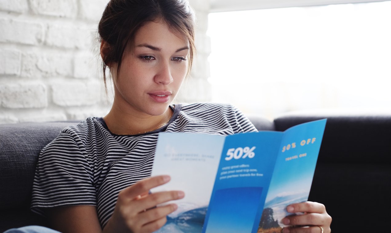 blog-flyer2x-1 women reading a trifold brochure